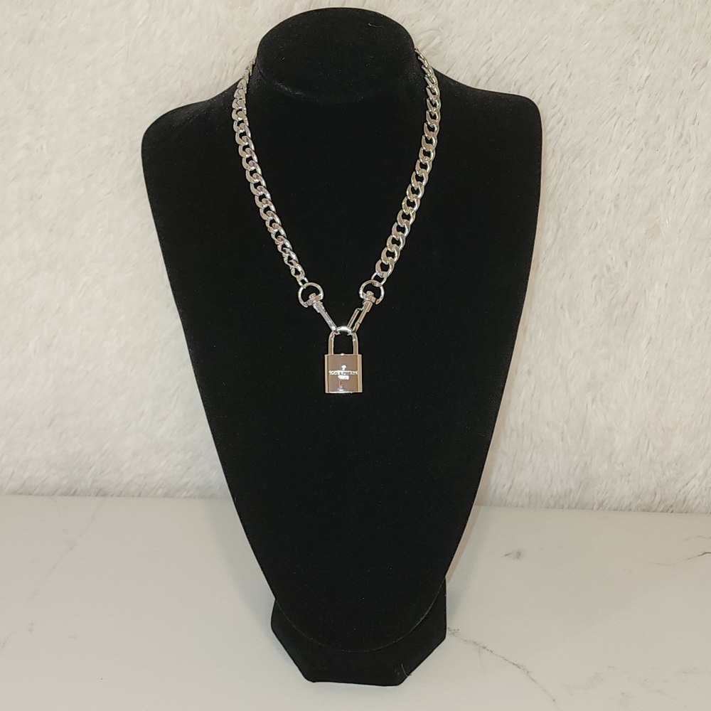 Authentic Silver Louis Vuitton lock and key